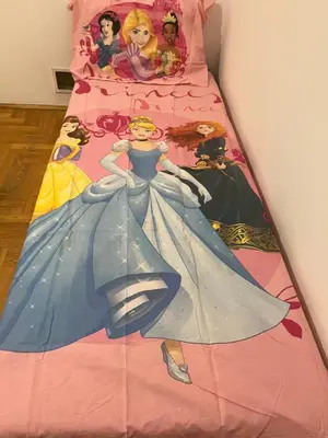 a bed with a disney princess picture on it at HOTEL&RESTAURACJA DALLAS LuxUSAPL - 2026 NOWA WŁAŚCICIELKA ZAPRASZA!! in Myślenice