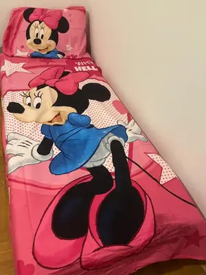a bed with a mickey mouse comforter on it at HOTEL&RESTAURACJA DALLAS LuxUSAPL - 2026 NOWA WŁAŚCICIELKA ZAPRASZA!! in Myślenice