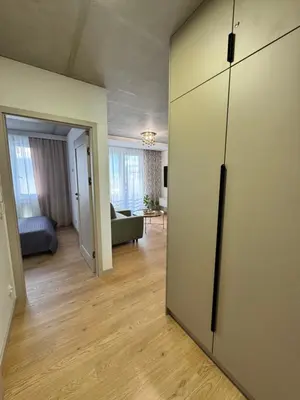 a living room with a sliding door to a living room at Piast Apartment - free parking in Kraków