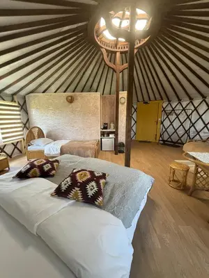 a bedroom with a bed in a yurt at Brzozowy Zagajnik in Inwałd