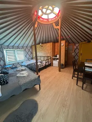 a room with two beds in a tent at Brzozowy Zagajnik in Inwałd