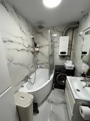 a bathroom with a shower and a tub and a sink at Pet-friendly 4-person apartment in Oświęcim