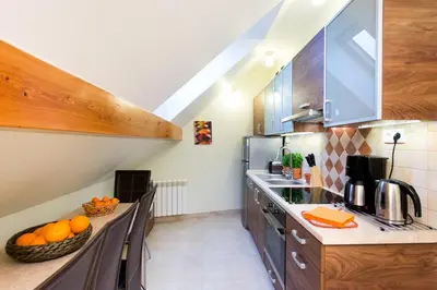 a kitchen with a counter with oranges on it at Vanilla 3, 4bdr 2bth apartment 5min to Main Square in Kraków