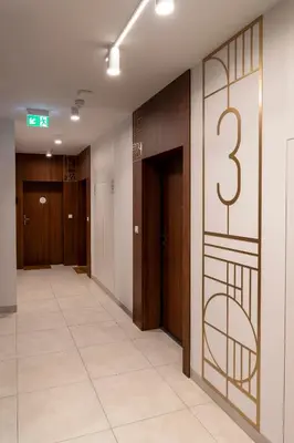 an empty hallway with a number on the wall at Apartament Orawska U Pana Cogito in Kraków