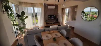 a living room with a couch and a table at MAnGo68 in Zator