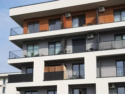 an apartment building with windows and balconies at MAnGo68 in Zator