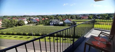 a balcony of a house with a view of a town at MAnGo68 in Zator