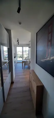 a living room with a large flat screen tv on a wall at MAnGo68 in Zator