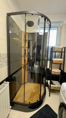 a large glass shower in a room with at Apartamenty Oracka Przystań Solna 2 in Bochnia