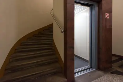 a staircase in a building with a glass door at Vanilla 4, 3bdr 1,5bth apartment in city centre in Kraków