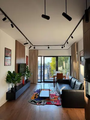 a living room with a couch and a table at Novum Escape in Kraków