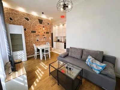 a living room with a couch and a table at Old Town Apt - Traugutta Street flat 5 in Kraków