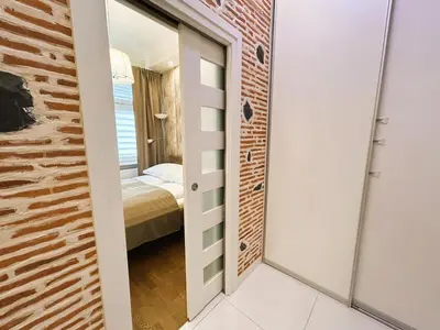 a room with a door leading to a bedroom at Old Town Apt - Traugutta Street flat 5 in Kraków
