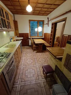 a kitchen with a sink and a table in it at Apartament Żmiąca in Jaworzna
