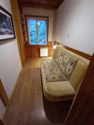 a living room with a couch and a window at Apartament Żmiąca in Jaworzna