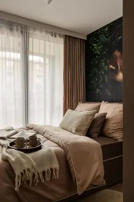 a bedroom with a bed with two cups on it at High Line by A11 in Kraków