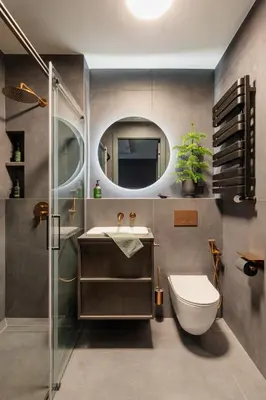 a bathroom with a sink and a toilet and a mirror at High Line by A11 in Kraków
