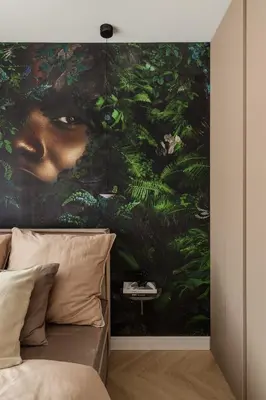 a bedroom with a large painting above a bed at High Line by A11 in Kraków