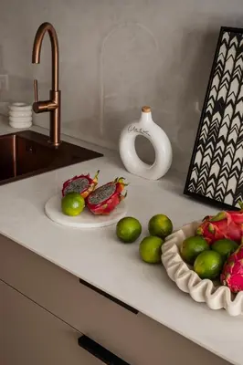a counter with two plates of limes and a vase at High Line by A11 in Kraków