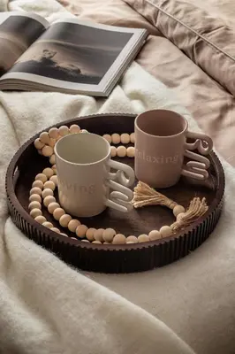 a tray with two coffee cups and a book at High Line by A11 in Kraków