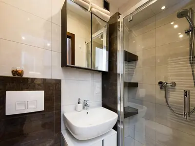 a bathroom with a sink and a shower at Vanilla 2, 3bdr 2bth apartment 5min to Main Square in Kraków