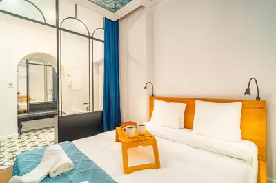 a bedroom with a bed with a table on it at Bosacka Apt - Top Location, Old Town nearby - by Rentujemy in Kraków