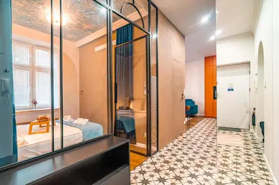a hallway with a room with a bed and a mirror at Bosacka Apt - Top Location, Old Town nearby - by Rentujemy in Kraków