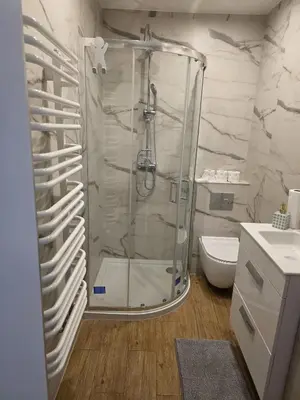 a bathroom with a shower and a toilet at u Wiktorii in Sąspów