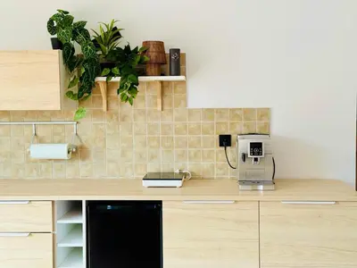 a kitchen with a counter with a coffee maker at Best Rest Kraków in Kraków