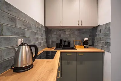 a kitchen with a tea kettle on a counter at Apartament Green Old Town Krakow in Kraków