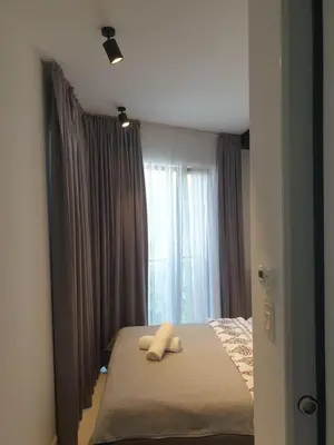 a bedroom with a bed with two pillows on it at Apartment Cracow Old Town in Kraków