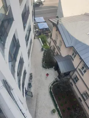 an overhead view of a courtyard between two buildings at Apartment Cracow Old Town in Kraków