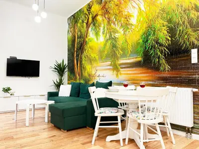 a living room with a green couch and a table at Premium & Quiet Apartment next to Main Square in Kraków