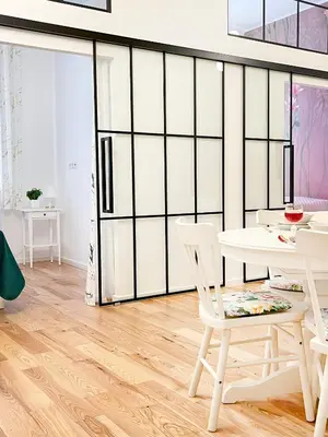 a dining room with white chairs and a table at Premium & Quiet Apartment next to Main Square in Kraków