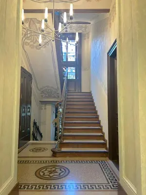 a hallway with a staircase in a building at Wawel z Balkonu - Apartament Premium, bezpłatny parking, szybkie Wifi in Kraków
