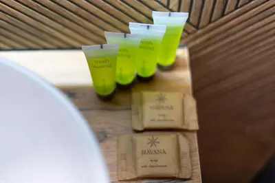 a group of green glasses sitting on a table at Pleszowska Urban Elegance Apartments by BookingHost in Kraków