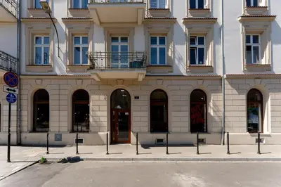 a building with a lot of windows and doors at Morsztynowska Studio with Mezzanine by BookingHost in Kraków