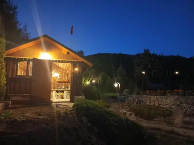 a small building with a light on top at night at Dom w Chomranicach-domek grillowy in Chomranice
