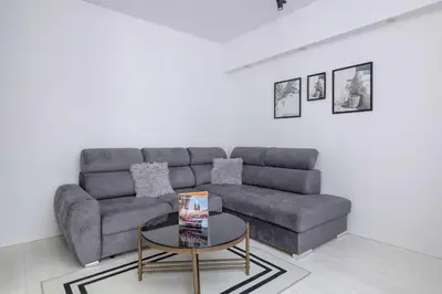 a living room with a couch and a table at Spacious Apartment in Wieliczka with AC & Parking in Wieliczka