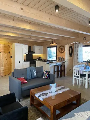 a living room with a couch and a table at Chata pod Groniem in Skawica