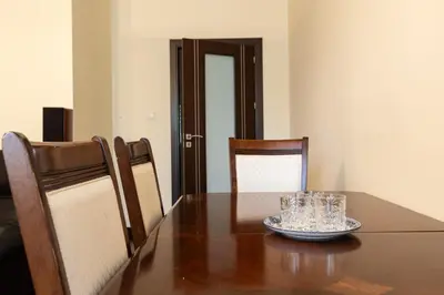 a dining room table with glasses on top of it at Apartament Kraków - Cracow Apartment 70m2 in Kraków
