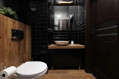 a bathroom with a white toilet and a sink at Krupnicza 10 by Homeprime in Kraków