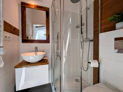 a bathroom with a sink and a shower at Dwernickiego 7 by Homeprime in Kraków