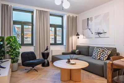 a living room with a couch and a table at Apartment next to Wawel, Premium Stay in Central Krakow by Koletek 3 in Kraków