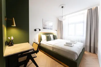 a bedroom with a bed and a desk and a table and a bed at Apartment next to Wawel, Premium Stay in Central Krakow by Koletek 3 in Kraków