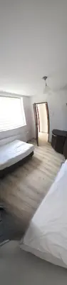a room with two beds and a window at Fabryka Snów NC in Niepołomice