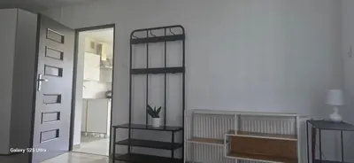 a room with a door and a room with a shelf at Fabryka Snów NC in Niepołomice