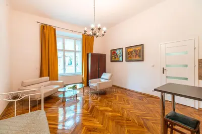 a living room with a couch and a table at Straszewskiego view in Kraków
