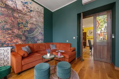 a living room with a couch and a colorful wall at Designer Apartment next to Wawel Castle by Renters Prestige in Kraków