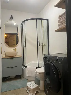 a bathroom with a shower and a toilet and a sink at Sielsko Anielsko Apartament in Zawoja